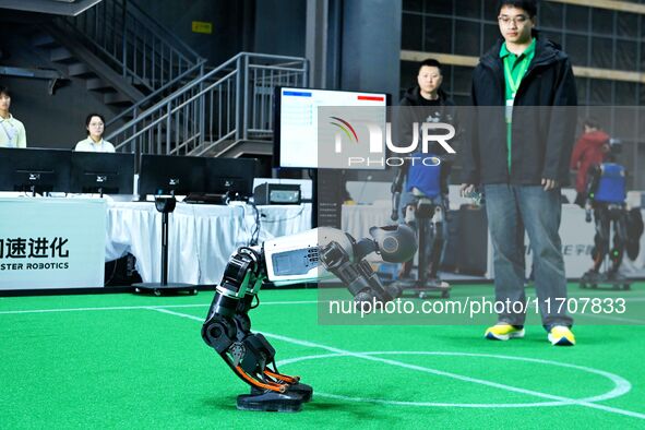 A robot stands up during a performance at the 2024 Asia Pacific Robot World Cup Qingdao International Invitational in Qingdao, Shandong, Chi...