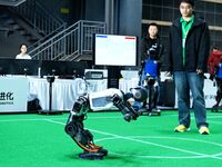 A robot stands up during a performance at the 2024 Asia Pacific Robot World Cup Qingdao International Invitational in Qingdao, Shandong, Chi...