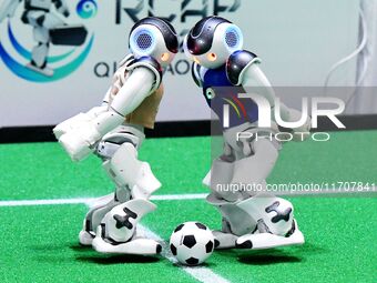 Robots play soccer at the 2024 Asia Pacific Robot World Cup Qingdao International Invitational in a football match in Qingdao, China, on Oct...