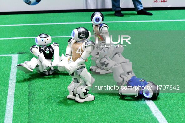 Robots play soccer at the 2024 Asia Pacific Robot World Cup Qingdao International Invitational in a football match in Qingdao, China, on Oct...