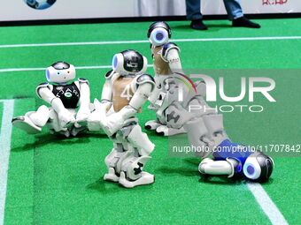 Robots play soccer at the 2024 Asia Pacific Robot World Cup Qingdao International Invitational in a football match in Qingdao, China, on Oct...