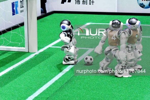 Robots play soccer at the 2024 Asia Pacific Robot World Cup Qingdao International Invitational in a football match in Qingdao, China, on Oct...