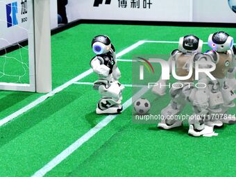 Robots play soccer at the 2024 Asia Pacific Robot World Cup Qingdao International Invitational in a football match in Qingdao, China, on Oct...