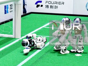 Robots play soccer at the 2024 Asia Pacific Robot World Cup Qingdao International Invitational in a football match in Qingdao, China, on Oct...