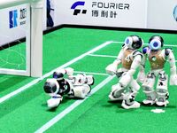 Robots play soccer at the 2024 Asia Pacific Robot World Cup Qingdao International Invitational in a football match in Qingdao, China, on Oct...