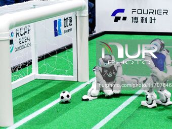 Robots play soccer at the 2024 Asia Pacific Robot World Cup Qingdao International Invitational in a football match in Qingdao, China, on Oct...