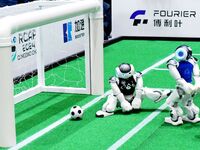 Robots play soccer at the 2024 Asia Pacific Robot World Cup Qingdao International Invitational in a football match in Qingdao, China, on Oct...