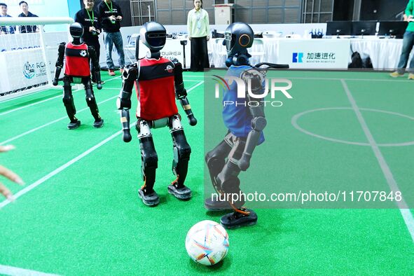 Robots play soccer at the 2024 Asia Pacific Robot World Cup Qingdao International Invitational in a football match in Qingdao, China, on Oct...