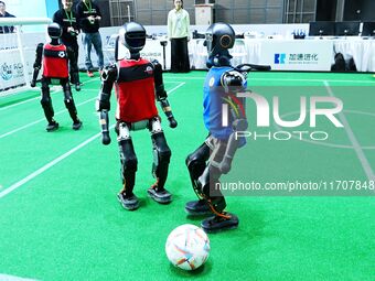 Robots play soccer at the 2024 Asia Pacific Robot World Cup Qingdao International Invitational in a football match in Qingdao, China, on Oct...