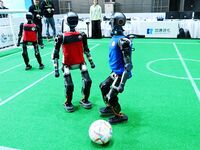 Robots play soccer at the 2024 Asia Pacific Robot World Cup Qingdao International Invitational in a football match in Qingdao, China, on Oct...