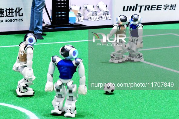 Robots play soccer at the 2024 Asia Pacific Robot World Cup Qingdao International Invitational in a football match in Qingdao, China, on Oct...