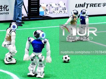 Robots play soccer at the 2024 Asia Pacific Robot World Cup Qingdao International Invitational in a football match in Qingdao, China, on Oct...