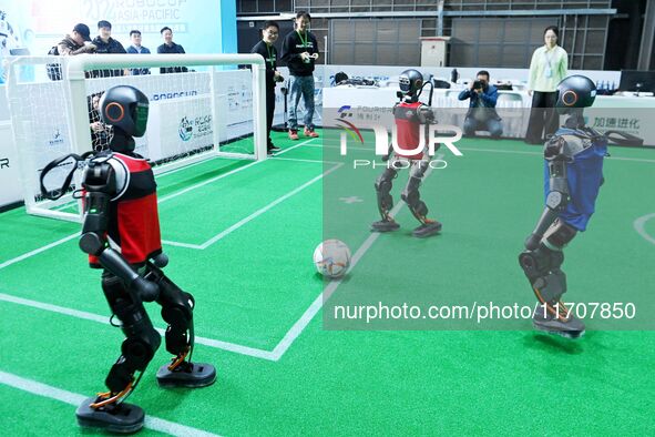 Robots play soccer at the 2024 Asia Pacific Robot World Cup Qingdao International Invitational in a football match in Qingdao, China, on Oct...