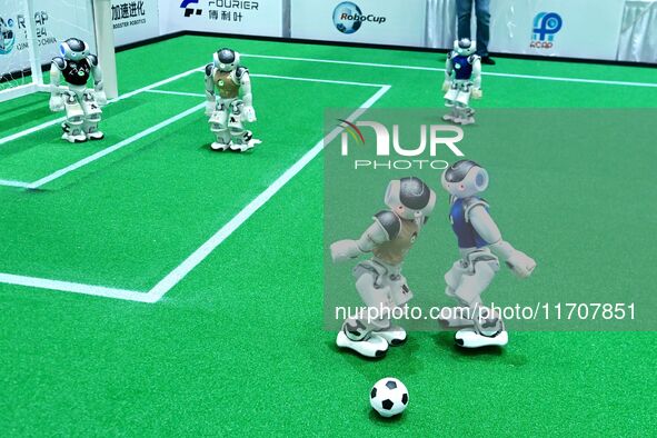 Robots play soccer at the 2024 Asia Pacific Robot World Cup Qingdao International Invitational in a football match in Qingdao, China, on Oct...