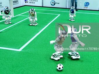 Robots play soccer at the 2024 Asia Pacific Robot World Cup Qingdao International Invitational in a football match in Qingdao, China, on Oct...