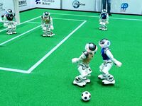 Robots play soccer at the 2024 Asia Pacific Robot World Cup Qingdao International Invitational in a football match in Qingdao, China, on Oct...