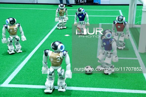 Robots play soccer at the 2024 Asia Pacific Robot World Cup Qingdao International Invitational in a football match in Qingdao, China, on Oct...