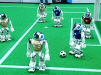 Robots play soccer at the 2024 Asia Pacific Robot World Cup Qingdao International Invitational in a football match in Qingdao, China, on Oct...