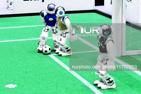 Robots play soccer at the 2024 Asia Pacific Robot World Cup Qingdao International Invitational in a football match in Qingdao, China, on Oct...