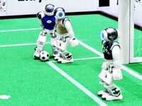 Robots play soccer at the 2024 Asia Pacific Robot World Cup Qingdao International Invitational in a football match in Qingdao, China, on Oct...