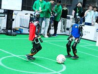 Robots play soccer at the 2024 Asia Pacific Robot World Cup Qingdao International Invitational in a football match in Qingdao, China, on Oct...