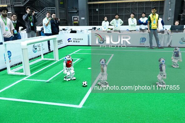 Robots play soccer at the 2024 Asia Pacific Robot World Cup Qingdao International Invitational in a football match in Qingdao, China, on Oct...