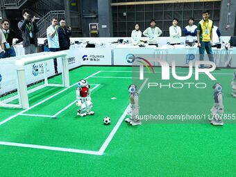 Robots play soccer at the 2024 Asia Pacific Robot World Cup Qingdao International Invitational in a football match in Qingdao, China, on Oct...