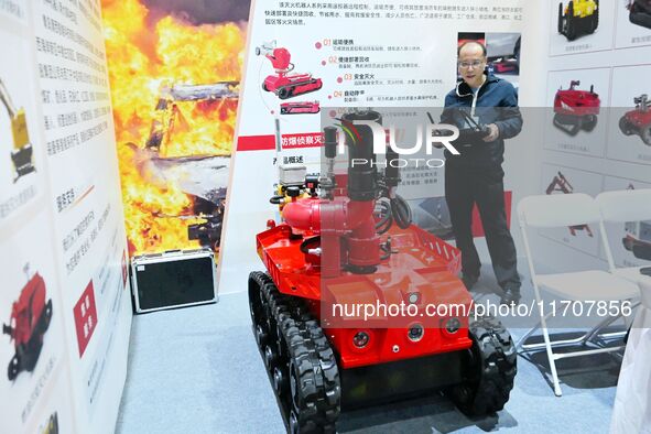 A company showcases a firefighting robot at the 2024 Asia Pacific Robot World Cup Qingdao International Invitational in Qingdao, China, on O...