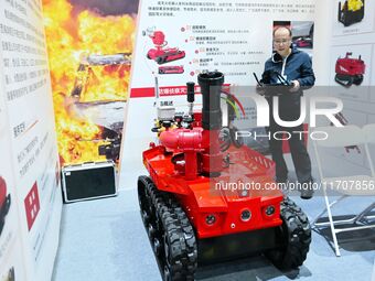 A company showcases a firefighting robot at the 2024 Asia Pacific Robot World Cup Qingdao International Invitational in Qingdao, China, on O...