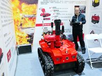 A company showcases a firefighting robot at the 2024 Asia Pacific Robot World Cup Qingdao International Invitational in Qingdao, China, on O...