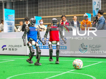 A robot plays in a soccer match at the Qingdao International Invitational Tournament of the 2024 Asia-Pacific RoboCup in Qingdao, China, on...