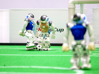 A robot plays in a soccer match at the Qingdao International Invitational Tournament of the 2024 Asia-Pacific RoboCup in Qingdao, China, on...