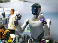 A robot demonstrates the dexterity of its fingers during the Qingdao International Invitational Tournament of the 2024 Asia-Pacific RoboCup...