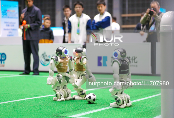 A robot plays in a soccer match at the Qingdao International Invitational Tournament of the 2024 Asia-Pacific RoboCup in Qingdao, China, on...