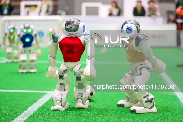 A robot plays in a soccer match at the Qingdao International Invitational Tournament of the 2024 Asia-Pacific RoboCup in Qingdao, China, on...