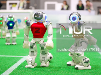 A robot plays in a soccer match at the Qingdao International Invitational Tournament of the 2024 Asia-Pacific RoboCup in Qingdao, China, on...