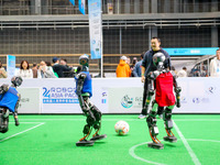 A robot plays in a soccer match at the Qingdao International Invitational Tournament of the 2024 Asia-Pacific RoboCup in Qingdao, China, on...