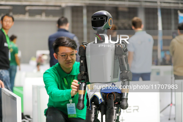 A player tests a robot during the Qingdao International Invitational Tournament of the 2024 Asia-Pacific RoboCup in Qingdao, China, on Octob...