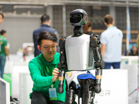 A player tests a robot during the Qingdao International Invitational Tournament of the 2024 Asia-Pacific RoboCup in Qingdao, China, on Octob...