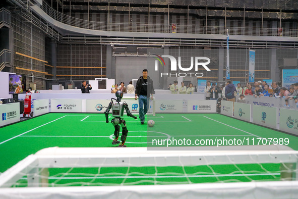 A robot plays with a ball during the Qingdao International Tournament of the 2024 Asia-Pacific RoboCup in Qingdao, China, on October 26, 202...