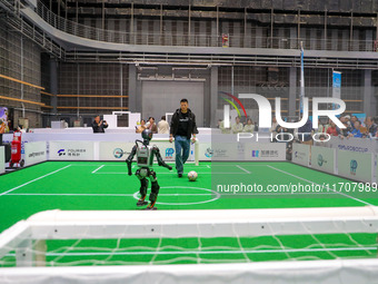 A robot plays with a ball during the Qingdao International Tournament of the 2024 Asia-Pacific RoboCup in Qingdao, China, on October 26, 202...