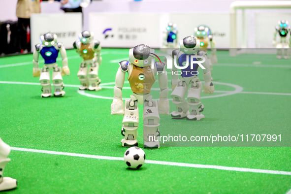 A robot plays in a soccer match at the Qingdao International Invitational Tournament of the 2024 Asia-Pacific RoboCup in Qingdao, China, on...