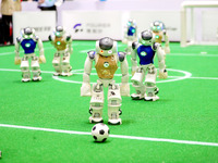 A robot plays in a soccer match at the Qingdao International Invitational Tournament of the 2024 Asia-Pacific RoboCup in Qingdao, China, on...