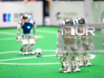 A robot plays in a soccer match at the Qingdao International Invitational Tournament of the 2024 Asia-Pacific RoboCup in Qingdao, China, on...