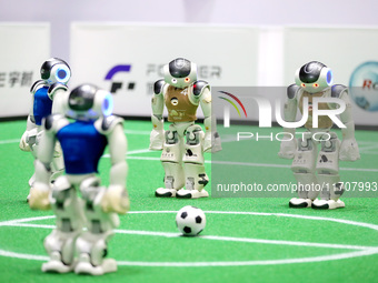 A robot plays in a soccer match at the Qingdao International Invitational Tournament of the 2024 Asia-Pacific RoboCup in Qingdao, China, on...