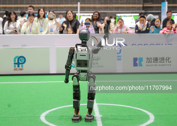 A robot waves to the audience during the Qingdao International Invitational Tournament of the 2024 Asia-Pacific RoboCup in Qingdao, China, o...