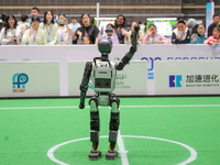 A robot waves to the audience during the Qingdao International Invitational Tournament of the 2024 Asia-Pacific RoboCup in Qingdao, China, o...