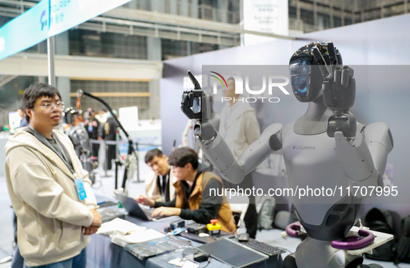 A robot demonstrates the dexterity of its fingers during the Qingdao International Invitational Tournament of the 2024 Asia-Pacific RoboCup...