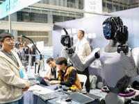 A robot demonstrates the dexterity of its fingers during the Qingdao International Invitational Tournament of the 2024 Asia-Pacific RoboCup...