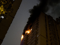 A Russian drone hits a residential high-rise in Kyiv, Ukraine, on October 25, 2024. A 14-year-old girl is killed, and at least 6 people are...